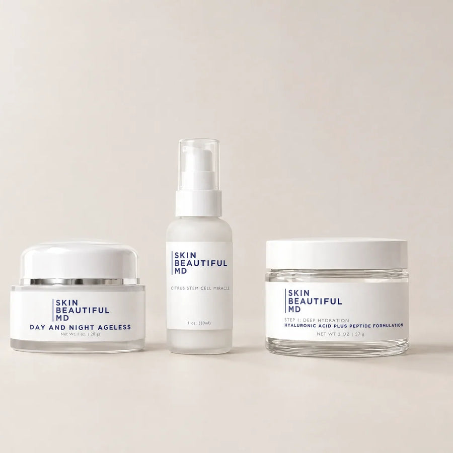 All three Skin Beautiful MD formulas in a row on a plain warm studio ground